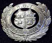 click for 3K .jpg image of DUTC bus badge